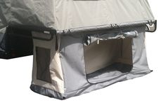 the back side of a tent with its door open and two doors closed on both sides