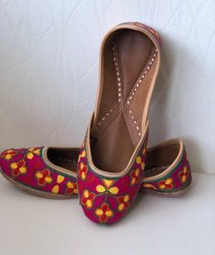 With the elegance of the embroidery work, this jutti is love at first site. Club this sophisticated piece with any outfit to get that perfect chic look.This multi coloured jutti is perfect for any occasion and any outfit.SPECIFICATIONS:•Upper/Panna - Embroidered Fabric base •Back/Adda - Embroidered Fabric base •Lining - Leather•Sole/Talla - Vegetable tanned leather soleNOTE: 1. Please mention the size you wish to order as per the size chart when you checkout. (Buyer should measure the foot from Traditional Flat Embroidered Wedding Shoes, Traditional Wedding Shoes With Embroidery And Round Toe, Embroidered Closed Toe Wedding Shoes, Flat Embroidered Wedding Shoes For Festivals, Embroidered Flat Wedding Shoes For Festivals, Traditional Embroidered Closed Toe Wedding Shoes, Embroidery Wedding, Punjabi Jutti, Leather Footwear