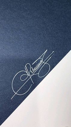 a close up view of the logo on a blue and white paper with some type of writing