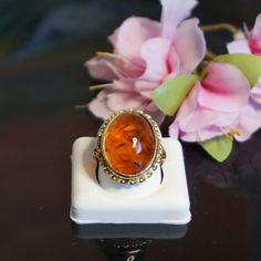 "Mid Century 9kt gold amber ring, Vintage Baltic amber ring, Large amber gold ring, Gift for her, November birthstone NT7 Marked 375 for 9 kt gold, maker mark, anchor for Birmingham, \"A\" for 1950 Baltic amber is oval shape  21x17mm,   Ring gallery 23,8x19,6,mm and 9,9 mm above the finger and band at the back is 2mm split shoulders  Ring Size 6 Total weight 5,86 gram Birthstone: November's birthstone is Amber. Amber is not an actual stone but fossilized sap from ancient trees, aging over millions of years. Amber symbolizes courage, and has been used in the Far East for protecting travellers and ward off bad spirits. The stone is in good condition promptly set , no damages or repairs. display box is not included. The ring will arrive in a contemporary gift box see last picture If you wish Victorian Gold Opal Ring Gift, Classic Amber Oval Cabochon Jewelry, Hallmarked Amber Oval Cabochon Jewelry, Oval Baltic Amber Gold Jewelry, Elegant Amber Cabochon Ring, Amber Cabochon Jewelry For Anniversary, Formal Amber 14k Gold Ring, Gold Signet Ring With Cabochon Gift, Gold Cabochon Signet Ring Gift