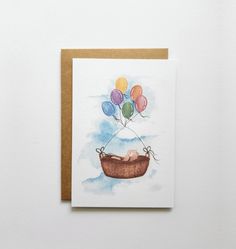 a card with balloons floating in the sky on top of a boat, which is attached to a string