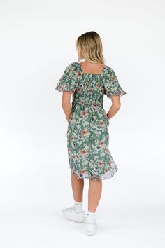 The Ashley dress stands out from the crowd in its beautiful green hue and fun floral pattern. Featuring puff sleeves and a flattering square neck, this dress is sure to make a statement. Whether you're feeling flirty for a night out or fun for a weekend, this stylish piece is the perfect choice. 100 Polyester Model is 5'6 wearing a small Holiday Tops, Man Swimming, Trending Now, Mommy And Me, Puff Sleeves, Square Neck, Puff Sleeve, Floral Pattern, Night Out