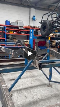 an image of a car being worked on in a shop or repair area with tools and equipment