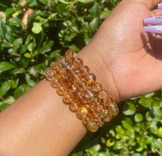 "Elevate your energy and attract good fortune with our Citrine Bracelet. This exquisite piece of crystal jewelry features genuine Citrine gemstones, known for their association with November birthdays, wealth, and prosperity. Healing Properties: Citrine: Often called the \"Merchant's Stone,\" Citrine is believed to bring abundance, luck, and success. It's also associated with boosting self-confidence and personal power. November Birthstone: Celebrate birthdays in November with this meaningful bi Amber Gemstone Beads Crystal Bracelet As Gift, Amber Crystal Bracelet With Gemstone Beads As Gift, Spiritual Round Amber Bracelet, Amber Crystal Bracelet With 8mm Beads As Gift, Handmade Spiritual Citrine Bracelets, Spiritual Citrine Crystal Bracelet With Gemstone Beads, Citrine Gemstone Beads Crystal Bracelet As Gift, Spiritual Citrine Crystal Bracelet With Natural Stones, Citrine Gemstone Beads Bracelet As Gift