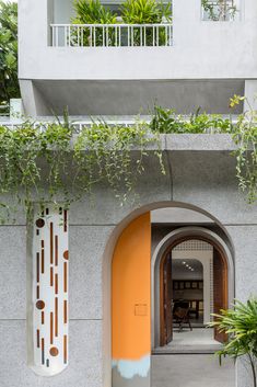 an entrance to a building with plants growing on it