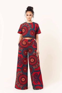 "This African print Ankara wide leg pants and top is a stunner. It is stylish and bold. Handmade with high quality African print 100% African cotton wax -Pants has 2 pockets -Zipper by the side -45\" long The top is lined and has zipper at the back. Also available in other prints, kindly contact Us for more fabric options via Etsy conversation We are opened to any customisation you might like. Thanks for looking." Bohemian Block Print Maxi Set, Bohemian Maxi Length Block Print Set, Bohemian Block Print Maxi Length Set, Bohemian Wide Leg Palazzo Set, Red Bohemian Maxi Sets, Cropped Two-piece Pant Set, Bohemian Sets With Floral Print And Wide Leg, Bohemian Floral Print Wide Leg Sets, Fitted Block Print Maxi Length Sets