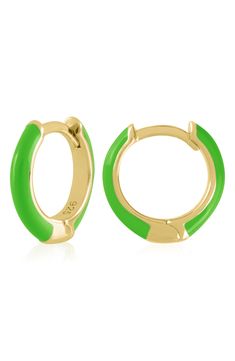 Easy-to-wear hoop earrings will add significant polish to even your most casual ensembles. 1/2" drop; 1/8" width Hinge with snap-post closure Sterling silver with goldtone plate/enamel Imported Small Hoop Enamel Earrings, Gold Enamel Round Huggie Earrings, Hoop Huggie Earrings In Enamel, Everyday Enamel Hoop Earrings, Everyday Green Huggie Earrings, Enamel Huggie Hoop Earrings For Pierced Ears, Trendy Enamel Hoop Jewelry, Green Pierced Hoop Earrings, Hypoallergenic Green Huggie Earrings