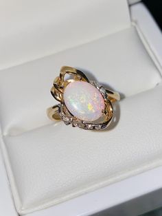 A brightly designed 14ct yellow gold ladies Opal & Diamond cocktail ring. A Vintage design with a lovely oval cut Australian Opal. Set with 6 brilliant cut natural diamonds. Ring size - M (UK), 6.5 (USA) 🔹Sale Price - £370.00 All articles come presented in a gift box Diamonds Ring, Diamond Cocktail Rings, October Birthstone, Australian Opal, Multi Stone Ring, October Birth Stone, Multi Stone, Vintage Yellow, Cocktail Ring