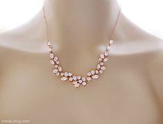 "This  sparkling and beautiful crystal necklace is made of high quality rose gold plated over brass components with Cubic Zirconia crystals and lobster clasp closure. All metal components are rose gold plated over brass. The necklace has 2\" extender chain. This listing is for the necklace only. Matching earrings: https://www.etsy.com/listing/606101976/rose-gold-bridal-earrings-crystal Matching earrings 2: https://www.etsy.com/listing/619963411/rose-gold-earrings-crystal-bridal Matching earrings 3: https://www.etsy.com/listing/619440912/rose-gold-crystal-chandelier-wedding Matching bracelet: https://www.etsy.com/listing/540745239/rose-gold-crystal-bracelet-cz-wedding If you have any questions please send a message and I will be happy to answer you.  Come in a gift box at no extra cost, rea Rhinestone Bridal Jewelry, Crystal Wedding Necklace, Gold Bridal Necklace, Crystal Pearl Earrings, Dangle Earrings Wedding, Crystal Bridal Earrings, Gold Bridal Earrings, Rose Gold Crystal, Rose Gold Bridal