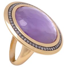 The 14.35 carat faceted cabochon amethyst is backed by an 8.07 carat natural mother of pearl, giving the amethyst its unusual yet stunning luster. The amethyst is set in 18 karat rose gold with a 0.57 carats of diamonds set in blackened gold, adding to the depth of this beautiful ring. Ring size 7 - Can be sized up or down Diameter is approximately 1.25" Cartier Diamond Rings, Mother Of Pearl Ring, Raw Diamond Rings, Diamond Rings With Price, Gold Diamond Band, Pearl And Diamond Ring, Diamond Fashion Rings, White Diamond Ring, Cabochon Ring