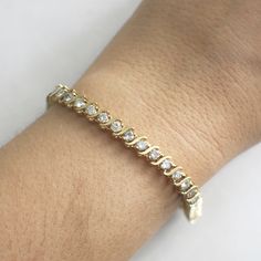 This diamond s link tennis bracelet is a classic staple for any jewelry collection! The diamonds are set in 18k yellow gold and circle the entire bracelet. Metal: 18K Yellow Gold Diamonds: 2.25 CTW SI2-I1 G-H Length: 7.25 For a greater selection of jewelry please visit our website at www.BlackMarketLLC.com If you have any questions about this product or if we can help you with any of our other products please contact us through Etsy or our website at www.BlackMarketLLC.com Each piece of our jewe Pink Emerald, Bracelet Metal, Diamond Tennis Bracelet, Yellow Gold Bracelet, Tennis Bracelet Diamond, Photo Bracelet, Wedding Bracelet, Tennis Bracelet, Diamond Bracelet