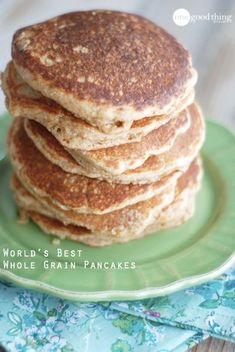 a stack of pancakes sitting on top of a green plate