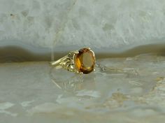 "10K Yellow Gold Citrine Ring, bypass design, 9x11 oval center stone deep honey color, Ring size 6, 3/8\" across, weight 3.25 grams Stock # BRT134R06 Most rings are sizable for a small fee. If the ring you are considering is the incorrect size contact us for a quote. This listing contains photographs of the actual item you will receive. Our items are in excellent condition with little or no signs of wear and many are one of a kind pre-owned estate finds. Please look closely at the pictures in th Gold Coin Ring, Honey Color, Coin Ring, Honey Colour, Citrine Ring, Fine Jewelry Designers, Size 10 Rings, Blue Topaz Ring, Color Ring