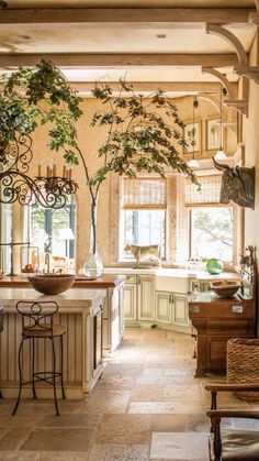 a large kitchen with an island in the middle and lots of counter space on each side