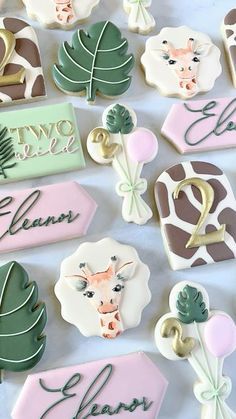 decorated cookies are displayed on a table