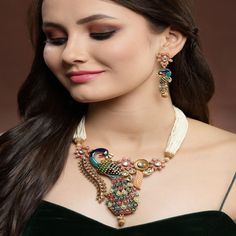 ABOUT JEWELRY We Present Latest Fashion Antique Fashion Peacock Necklace Jewelry set for women. Necklace set Jewelry Decoration with High Quality Kundan Stone, Pearls material. Stunning Party wear, Wedding Neckwear Piece , ethnic wear jewelry for Women. Gold Plated multicolor  Pearl and atone Studded Bridal Wedding Necklace jewelry for Brides and Bridesmaids. Our products are skin-friendly & with love to reach your heart. CONTENT & DIMENSION::- The package includes 1 Necklace,  1 Pair Earrings PACKAGING::- This Jewelry will come nicely wrapped in a bubble wrapped in a white box preventing any kind of Damage. OCCASION::- Gracefully Necklace Jewelry pair with Designer Saree, suit, Wedding Lehenga, Indian Outfit or any Indo-western outfit to enhance your look with Indian Kundan Jewelry set. P Luxury Peacock Design Necklaces For Women, Wedding Kundan Peacock Pendant Necklace, Elegant Multicolor Peacock Design Necklace, Festive Kundan Peacock Pendant Necklace, Ornate Peacock Design Necklace For Gift, Tikka Jewelry, Kundan Jewellery Set, Peacock Necklace, Stone Bar