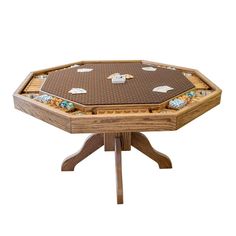 a wooden table topped with lots of dices on it's sides and four legs