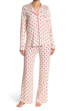 A soft jersey knit pajama set with a pretty print delivers feminine style and essential comfort. 2-piece set Shirt: 25" length (size S); Pants: 9.5" rise, 32" inseam (size S) Shirt: notch lapel, long sleeves, front button closures, chest patch pocket, allover print, contrast piping, knit construction Pants: elasticized waist, pull-on style, allover print, knit construction 95% rayon, 5% spandex Machine wash cold Imported Model’s stats for sizing: 5’11” height, 32” bust, 24” waist, 34” hips. Mode Casual Printed Long Sleeve Sleepwear, Casual Long Sleeve Printed Sleepwear, White Printed Long Sleeve Sleepwear, Casual Fitted Sleepwear For Bedtime, Fitted Casual Sleepwear For Bedtime, Long Sleeve Printed Loungewear Sets, Long Sleeve Printed Lounging Sets, Printed Long Sleeve Lounging Sets, Long Sleeve Printed Lounge Sets