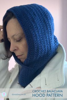 a woman wearing a blue crochet hood pattern