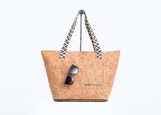 Spice up your daily routine or head to the beach in style with the Ormond Bucket Beach Bag. Made from water-resistant cork fabric, this bag has plenty of space for all your essentials and features a zippered closure, lightweight design, and comfortable straps. Plus, there's an exterior pocket for easy access to your must-haves. It's the perfect combination of fashion and functionality! FEATURES Water Resistant Zipper closureWoven patterned Shoulder Strap11.5" Drop Interior - zippered pocket & op Cork Material, Instagram Beach, Cork Fabric, Linen Set, Natural Baby, Romper With Skirt, Bagpack, Jewelry Bags, Spice Up