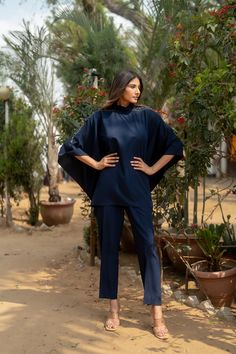 This stylish set includes a blue kaftan top paired with trouser pants, both adorned with hand embroidery designs on the shoulders. Made from lightweight and comfortable fabric, it's ideal for summer wear. Whether you're heading to the office, going on a resort vacation, or attending a party, this coordinated set offers a chic and versatile option for women and girls alike Fabric - Georgette Bubble Sleeve - 3/4 Sleeves Work - Embroidery Hand Work Color - Solid Blue Top Length - 29 Bottom Length - Elegant Straight Kurta Palazzo Set For Work, Elegant Palazzo Set With Straight Kurta For Work, Eid Party Straight Kurta Top, Straight Kurta Tops For Eid Party, Party Straight Kurta Top For Eid, Festive Palazzo Set For Party, Festive Straight Palazzo Set For Party, Festive Palazzo Set For Party With Straight Pants, Festive Party Palazzo Set With Straight Pants