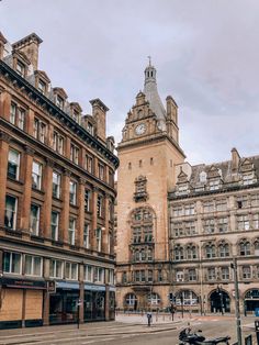 an old building with a clock tower in the middle