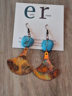 These boho style earrings feature wire wrapped turquoise gemstone beads with fan shaped fire painted copper dangles. The copper was fire painted using a propane torch to bring out the different colors in the metal when heated. NOTE:  Certain lighting will bring the colors out more than other types of lighting. Thes earrings measure just over 2.5" in length.  They will ship in a gift box via USPS with tracking info provided. Unique Hand Painted Copper Jewelry, Bohemian Jewelry In Copper Wire With Patina, Blue Bohemian Hand Forged Earrings, Artsy Hand Forged Copper Jewelry, Blue Hand Forged Bohemian Earrings, Artsy Hand Painted Copper Earrings, Turquoise Copper Earrings, Bohemian Copper Jewelry With Patina, Unique Hand-painted Copper Jewelry