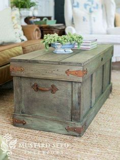 an old trunk is used as a coffee table