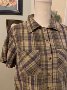 Vintage women's plaid short sleeve collared shirt with button front and two chest pockets.  Label: Erika  No size label  Measurements taken flat, please double where needed  Shoulder to shoulder: 15 inches  Underarm to underarm: 20.5 inches  Sleeve length: 8 inches  Shoulder to hem: 20.5 inches Relaxed Fit Collared Flannel Shirt With Buttons, Casual Short Sleeve Flannel Shirt With Button Closure, Summer Collared Flannel Shirt With Button Closure, Plaid Flannel Shirt With Short Sleeves, Casual Short Sleeve Flannel Shirt, Plaid Shirt With Buttons In Relaxed Fit, Plaid Short Sleeve Shirt With Relaxed Fit, Classic Short Sleeve Flannel Shirt For Summer, Plaid Flannel Shirt With Short Sleeves And Button Closure