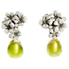 This is a piece from the contemporary jewelry collection, which was featured in a review in Vogue UA and designed by the oil painter from Berlin, Polya Medvedeva. These clip-on earrings are made of 18 karat white and yellow gold, and encrusted with six round diamonds (0.18 carats), and cabochon yellow quartzes (lemon citrines). The size of one earring is 2x1.7 cm, and the depth without a lock is 5 mm. We use top natural diamonds VS, F-G and we work with a German gems company that has been in the Yellow Gold Drop Earrings, Cocktail Earrings, Plum Flowers, Yellow Quartz, Contemporary Earrings, Pearl And Diamond Earrings, Diamond Quartz, Fancy Diamonds, Green Quartz