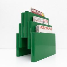 a stack of green folders sitting on top of each other