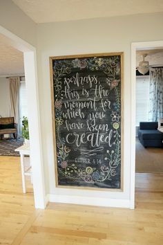 a chalkboard in the corner of a room with a quote on it that says, perhaps this is the moment when you have been created