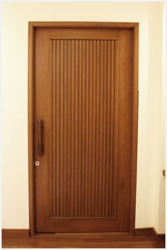 a wooden door with vertical slats on it