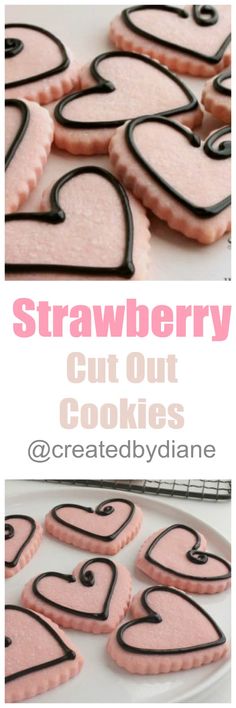 strawberry cut out cookies with black and pink icing on them are ready to be eaten