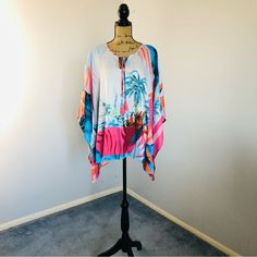 Jm Collection Women's Tropical-Print Poncho Sz 3x Nwt. Measures Approx. 29” In Length; Armpit To Armpit Approx. 33” Flat. Capture A Taste Of The Islands With This Tropical-Print Poncho From Jm Collection. Poncho Sleeves Scoop Neckline With Tie Closure Relaxed Fit; Hits At Hip Due To Generous Sizing, We Suggest Sizing Down For The Perfect Fit Polyester Machine Washable #Lisamariesvibe #Jmcollection #Resort #Resortwear #Tropical #Destination #Beach #Pool #Vacation #Cruise #Travel #Poncho #Palmtree Multicolor Tops For Beach Season Loungewear, Casual One Size Poncho For Vacation, Casual One-size Poncho For Vacation, Oversized Multicolor Beach Top, Oversized Multicolor Tops For Beach, Multicolor One Size Poncho For Vacation, Multicolor One-size Poncho For Vacation, Oversized White Beachwear Top, One Size Multicolor Beach Tops