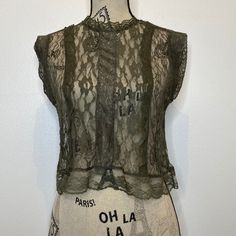 Romeo & Juliet Couture Olive Green All Lace Crop Top Sleeveless Size: Medium Condition: New With Tag Fabric Content: 100% Polyester Measurements Are Taken Laid Flat: B: 18” L: 18” Bundle For A Better Discount. Comes From A Smoke Free Home. If You Want More Information, Please Don’t Hesitate To Ask Any Questions Needed! Chic Sleeveless Sheer Top, Sheer Fitted Sleeveless Tank Top, Fitted Lace Trim Tank Top, Fitted Sleeveless Lace Blouse, Fitted Sleeveless Lace Top, Sheer Sleeveless Blouse, Fitted Sleeveless Lace Tank Top, Sleeveless Sheer Lace Tops, Chic Fitted Sleeveless Lace Blouse