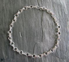 "Here is a spectacular chain I made from 16 gauge sterling silver round wire. I made two sizes of rings and soldered each and every one together into an 21\" chain. There are large rings separated by three smaller rings. The clasp is a handmade hook. I then tumble polished the chain for strength and shine. A classic chain that is easy to dress up or down. A gift perhaps (for yourself or a special person) The first three chains like this sold so quickly I had to make another! Kind of wish I could Large Rings, Silver Smithing, Large Ring, Small Rings, Hand Made Jewelry, Long Chain, Handmade Sterling Silver, Special Person, Sterling Silver Chain