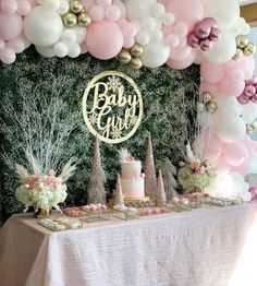 a baby shower party with balloons, cake and desserts on a table in front of a backdrop