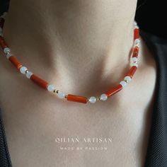 *Handcrafted Excellence: Each piece is meticulously handmade, ensuring a personal touch in every choker necklace. *Adjustable Size: Features a 14-inch choker length with a 5cm extension chain for customizable fitting. *Exclusive Design: Designed exclusively by me, this choker showcases a unique blend of creativity and craftsmanship. Key Highlights of the "Red Agate & White Jade" Choker Necklace: *Main Materials: This unique choker necklace is primarily made of red agate and white jade. The combination of these materials gives the necklace a distinctive style and profound meaning. *Red Agate: The cylindrical red agate pieces are deeply polished and intricately carved, setting the tone for the overall design with their vibrant color and natural beauty. The rich red hue of the agate exudes wa Handmade Spiritual Choker As A Gift, Handmade Spiritual Choker For Gift, Elegant Choker With Natural Stones And Round Beads, Gemstone Beaded Choker Necklace As Gift, Gemstone Beaded Choker Necklace For Gifts, Minimalist Gemstone Beads Choker As Gift, Minimalist Gemstone Beads Choker Gift, Amber Beaded Necklaces With Spacer Beads As Gift, Agate Spacer Beads Jewelry Gift