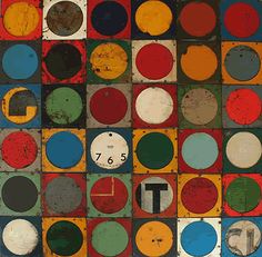 an image of a clock made out of different colored circles