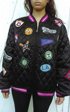 "Vintage Black Baseball Teams Coat American baseball Teams Patches By All Players unisex Fantastic Black Coat with full of all american baseball teams players logo patches. The coat is by Star Players. The cuff and the collar are stripes pink, white a black. Its made of very good material and is in great conditions. My daughter has spent several hours cleaning off the lint off the jacket from the cuff, neck and hips. The material of the jacket is made of polyester and is quilted. It has two comf Baseball Teams, Team Player, All American, Baseball Team, Black Coat, Canada Goose Jackets, Patch Logo, Vintage Black, Varsity Jacket