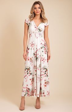 Welcome the new season with delicate blossoms and dusky pink and sage green tones. Our pink petal floral design is now available in our signature Sophia Maxi jersey dress. Cut with care to drape beautifully from empire line to full flowing skirt, our Sophia maxi is made from the softest jersey and features a cinched in waist and gathering around the bust for a flattering shape. Maxi dress in dusky pink blossom design over an oyster ground Soft, sumptuous and breathable viscose jersey Flattering Elegant Rose Print Spring Maxi Dress, Elegant Rose Print Maxi Dress For Spring, Elegant Spring Maxi Dress With Rose Print, Flowy Floral Print Maxi Dress With Empire Waist, Elegant Rose Print Maxi Dress For Garden Party, Floral Print Maxi Dress With Empire Waist, Floral Print Empire Waist Maxi Dress For Garden Party, Flowy Floral Maxi Dress With Surplice Neckline, Feminine Fitted Floral Dress With Surplice Neckline