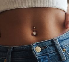 a close up of a person's stomach with buttons on the bottom of their belly