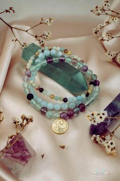 Wear this powerful Water element bracelets stack when you feel the need to connect with celestial energies of the universe and draw in peace, strength and calmness. This gemstone stretch bracelet trio of Aquamarine, Amazonite and Fluorite offers transmutive energy and harmonizes effortlessly, helping you adjust and adapt to natural flows of life. Water element charm, symbolizing balance, communication and aura cleansing, adds a soulful touch to this gorgeous bracelet stack. Water Element: Cool, Spiritual 8mm Beads Wrap Bracelet For Healing, Spiritual Healing Wrap Bracelet With 8mm Beads, Spiritual Healing Wrap Bracelet With Round Beads, Mystical Healing Gemstone Beads Bracelets, Spiritual Healing Gemstone Beads Wrap Bracelet, Mystical Healing Gemstone Beads Bracelet, Spiritual Stackable Healing Stretch Bracelet, Spiritual Stackable Bracelet For Healing, Spiritual Healing Stackable Stretch Bracelet