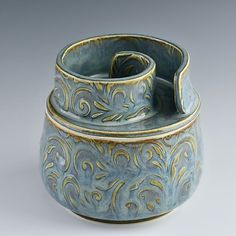 a blue and gold decorated ceramic container