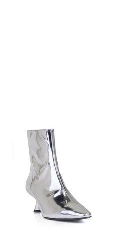 Upgrade your wardrobe with the sleek and stylish Simon Miller Kuki Ankle Boot. Made from metallic chrome silver leather, it features a classic pointed toe and sculptural kitten heel for a timeless yet modern look. Elevate any outfit with this must-have addition. Details: Color: Chrome 100% leather Heel height: 5cm/2in Boot shaft: 16cm Vendor Code: F171-9137 Zip closure Fits true to size; European sizing Spring Knits, Chrome Silver, Simon Miller, Belt Jewelry, Knitting Gift, Hair Fragrance, Optical Glasses, Color Chrome, Small Accessories