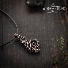 Wire wrapped bohemian style copper necklace pendant with natural black Onyx gemstone. Copper was oxidized to create antique look and to highlight the details of the wire work. It is a unisex necklace so it fits both men and women. This copper necklace comes with brown waxed cotton cord which has adjustable sliding knot and it can easily be adjusted to your preferred length ( approximately from 12 to 24 Inches). This necklace was made out of natural copper wire, so it is going to get darker over Adjustable Black Copper Necklace, Artisan Black Copper Necklace, Unique Black Copper Jewelry, Adjustable Wire Wrapped Onyx Necklace, Black Bohemian Hand Wrapped Jewelry, Black Bohemian Hand-wrapped Jewelry, Bohemian Black Hand Wrapped Jewelry, Adjustable Hand Wrapped Copper Crystal Necklaces, Adjustable Hand Wrapped Copper Crystal Necklace