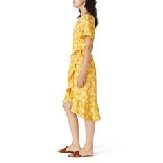 Yellow floral printed crepe (100% Polyester). Wrap. Short sleeves. V-neckline. Wrap closure. Fully lined. 39" from shoulder to shortest hemline, 45" from shoulder to longest hemline. Imported. Fitted Rayon V-neck Summer Dress, Summer Floral Print V-neck Dress For Daywear, Summer Viscose V-neck Wrap Dress, Spring Knee-length Viscose Wrap Dress, Fitted Viscose Wrap Dress For Summer, Summer Viscose Wrap Dress With Surplice Neckline, Summer V-neck Wrap Dress In Viscose, Summer V-neck Viscose Wrap Dress, Summer Viscose Wrap Dress With V-neck