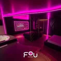 a bedroom with purple lighting and a hot tub