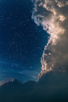 the sky is filled with stars and clouds